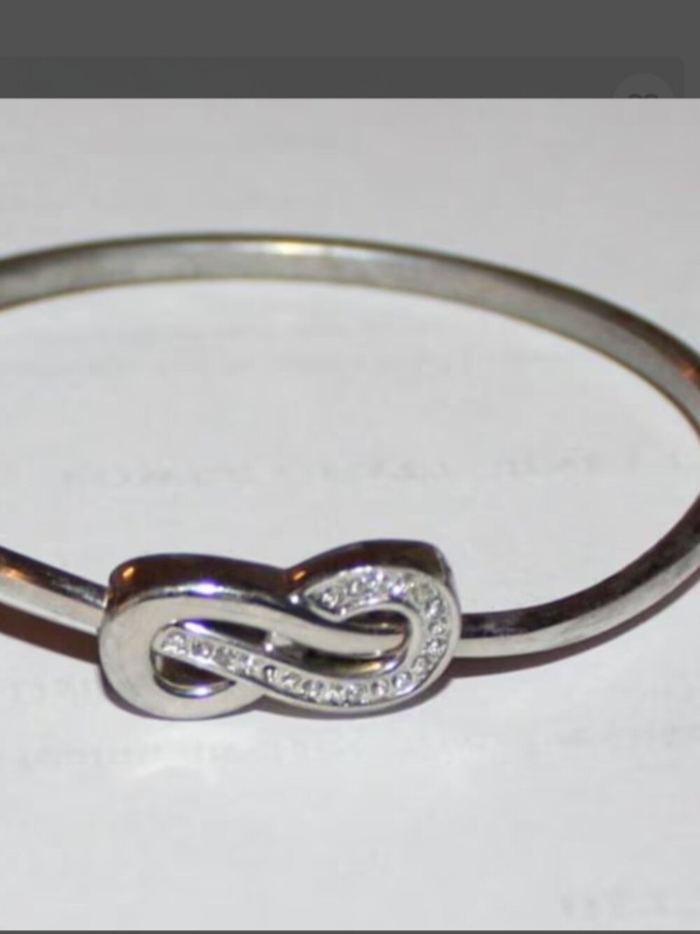 Silver Tone Infinity Knot Bangle Bracelet Sparkling Accents Hinged Crossover